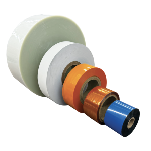 Five rolls of Unit Dose Blisters & Cards (Copy) in various sizes, arranged from largest to smallest. Colors from back to front: white, white, orange, brown, and blue. The rolls are displayed on a white background.