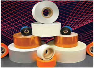 Several large rolls of adhesive tape in white, orange, and transparent colors are stacked in a pyramid, with a digital red and blue grid pattern in the background.